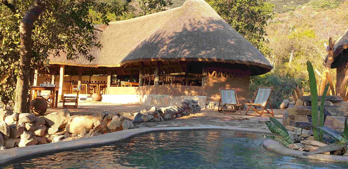The thatched lounge, bar and pool