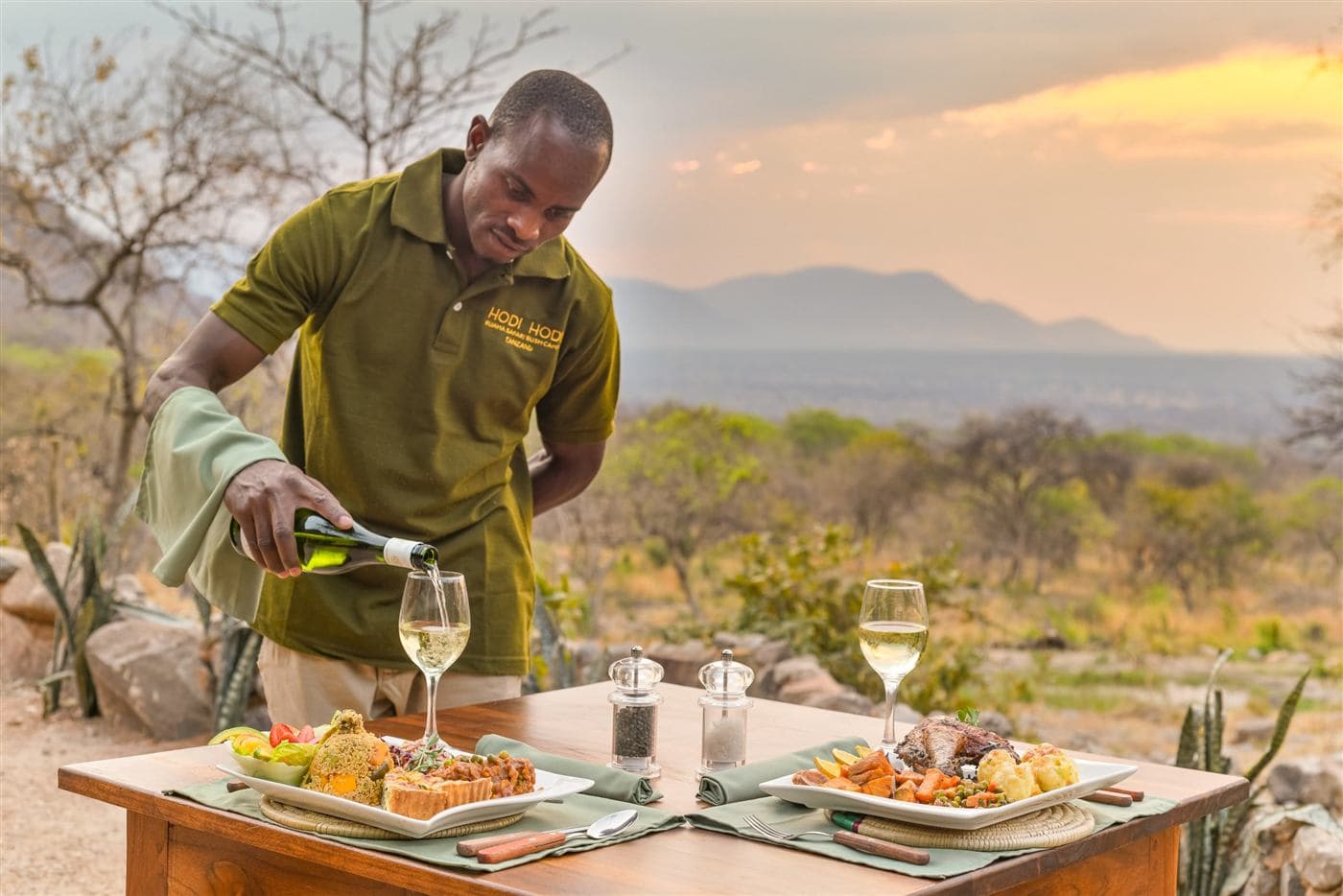 Wine poured at a sunset dinner in the bush